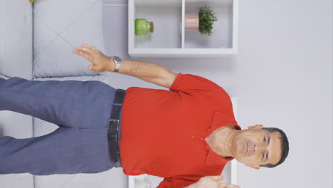 Vertical-video-of-Fun-old-man.-The-old-man-is-making-fun-and-cute-moves.